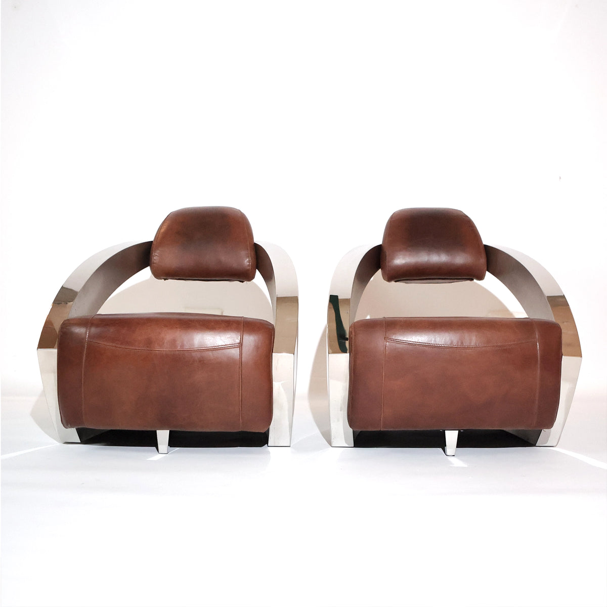 Par de sillones vintage Demon/Aviador en piel color coñac y acero pulido, estilo Art Déco