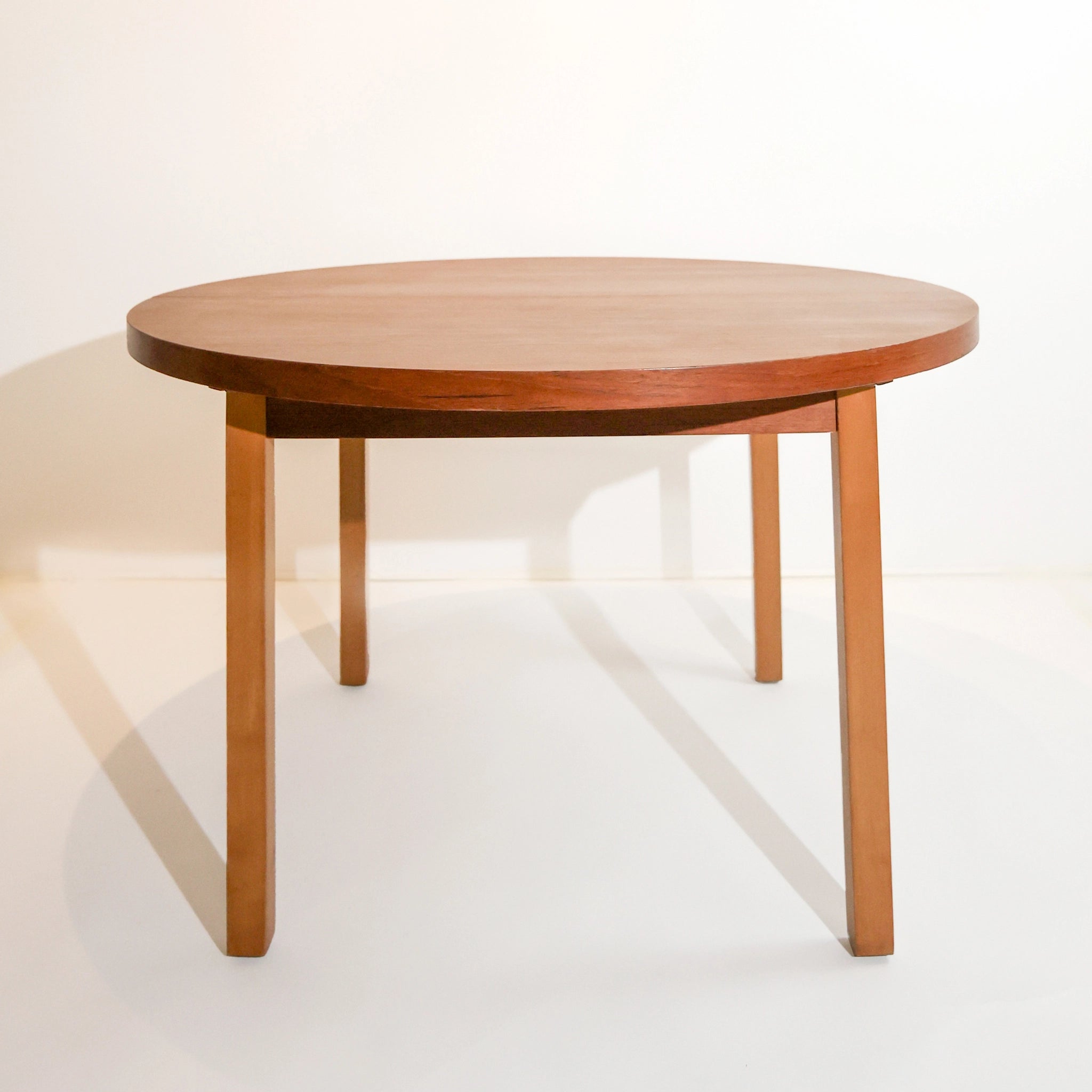 Scandinavian round dining table from the 1960s with a butterfly leaf extension.