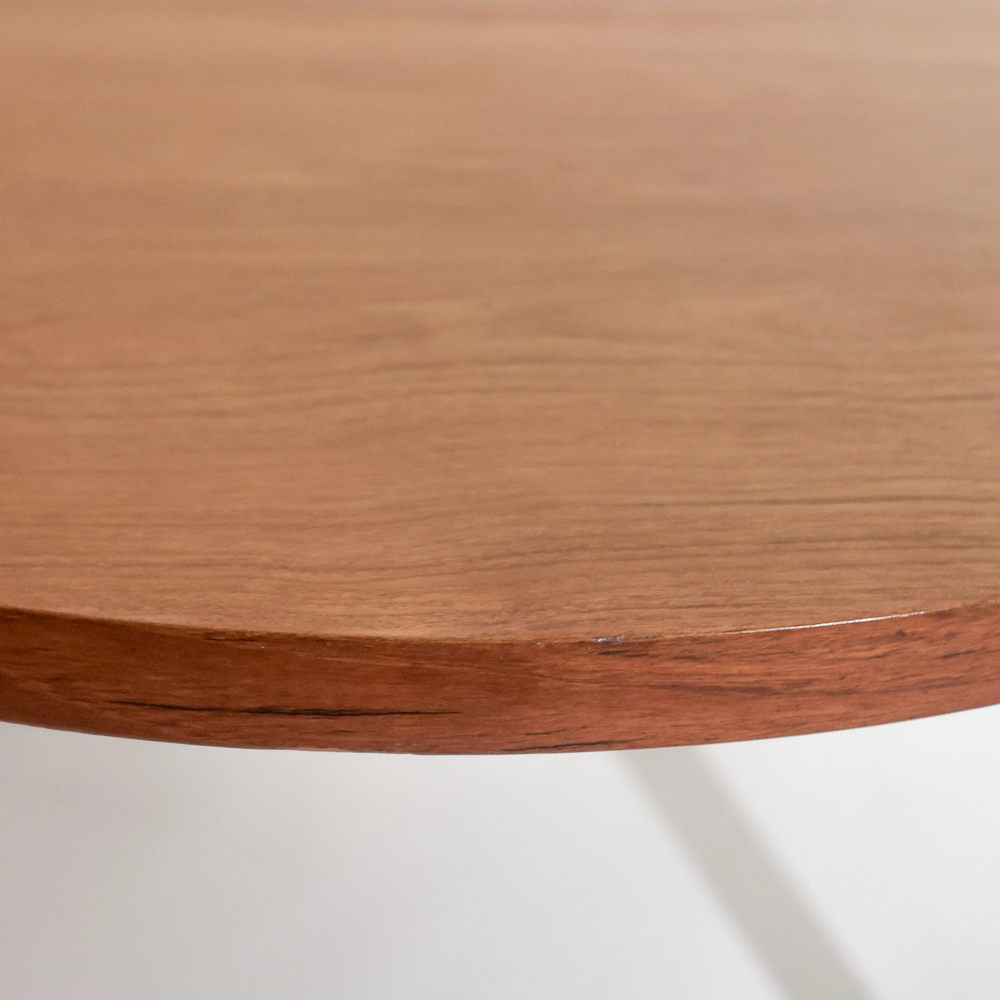 Scandinavian round dining table from the 1960s with a butterfly leaf extension.